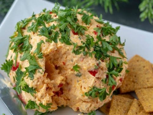 Try this festive Roasted Red Pepper Ranch Cheese Ball for your next gathering. Easy to make with only a handful of ingredients!