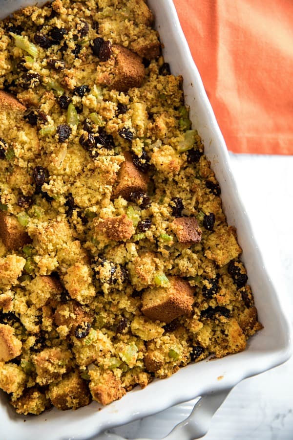 Southern Cornbread Stuffing (aka Dressing) made with vegetables, spices and plump raisins is from a favorite West Virginia family recipe. #mustlovehomecooking