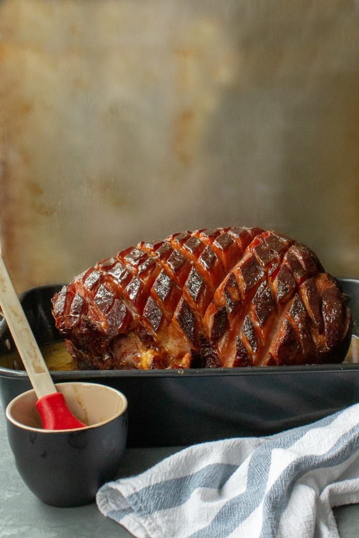 So easy and delicious, perfectly caramelized Brown Sugar Rum Baked Ham will be the centerpiece of your Sunday or holiday dinner table. Great for parties and potlucks too!