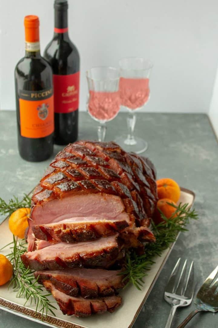 So easy and delicious, perfectly caramelized Brown Sugar Rum Baked Ham will be the centerpiece of your Sunday or holiday dinner table. Great for parties and potlucks too!
