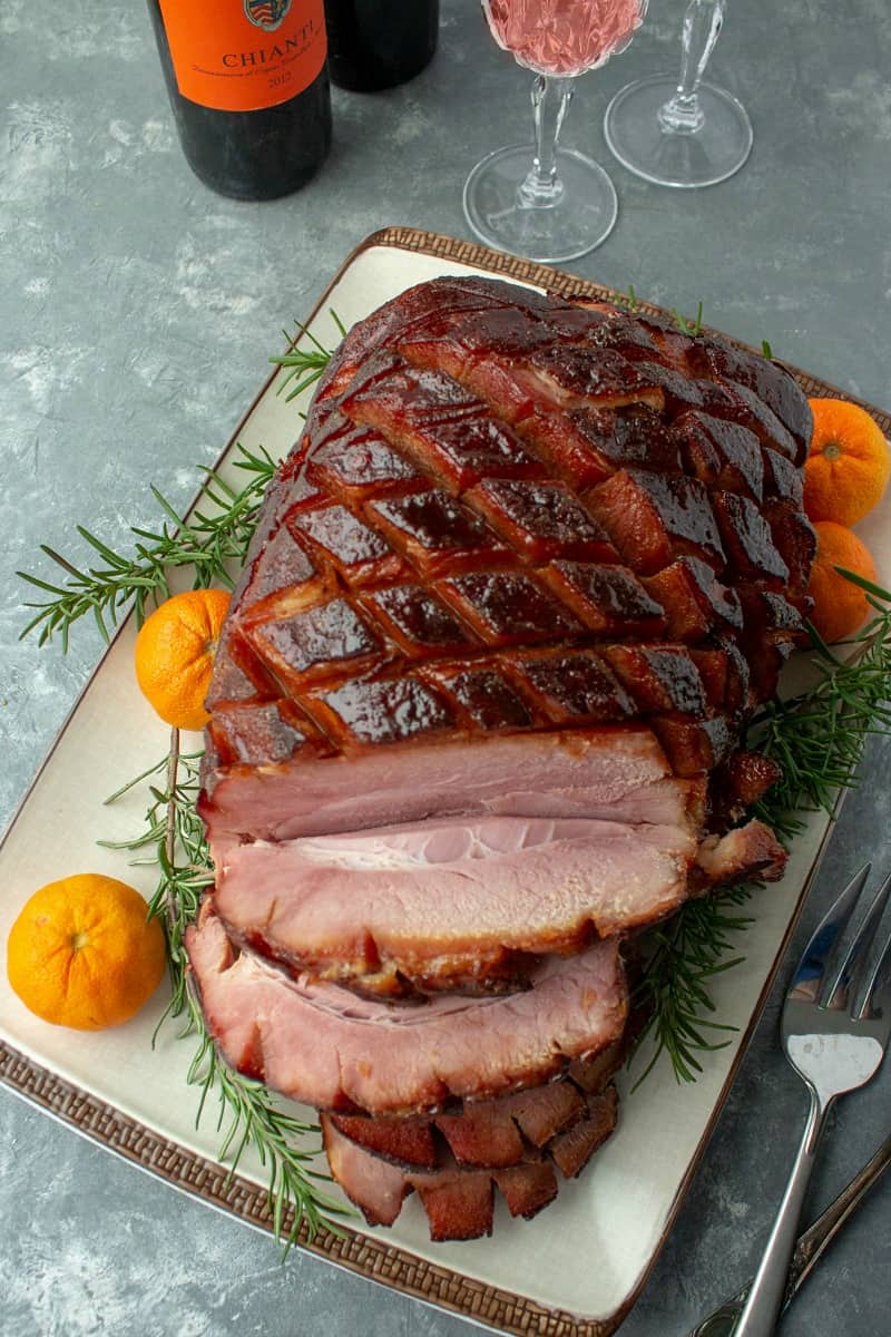 So easy and delicious, perfectly caramelized Brown Sugar Rum Baked Ham will be the centerpiece of your Sunday or holiday dinner table. Great for parties and potlucks too!