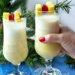 Snow Day Pina Colada is a smooth and delicious winter cocktail made with rum, coconut cream and a healthy shot of peppermint schnapps!