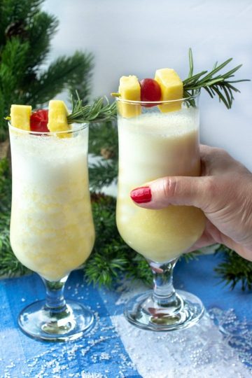 Snow Day Pina Colada is a smooth and delicious winter cocktail made with rum, coconut cream and a healthy shot of peppermint schnapps!
