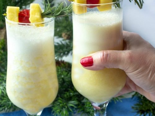 Snow Day Pina Colada is a smooth and delicious winter cocktail made with rum, coconut cream and a healthy shot of peppermint schnapps!