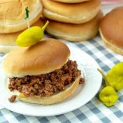 Slow Cooker Sloppy Joes, made with ground beef soaked in a savory sauce of  tomatoes, ketchup, barbecue sauce and spices. Makes enough to feed a crowd or to freeze for later!