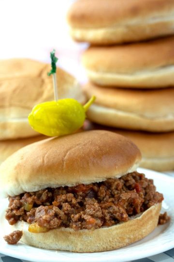 Slow Cooker Sloppy Joes, made with ground beef soaked in a savory sauce of  tomatoes, ketchup, barbecue sauce and spices. Makes enough to feed a crowd or to freeze for later!