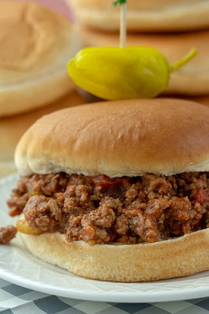 Slow Cooker Sloppy Joes, made with ground beef soaked in a savory sauce of  tomatoes, ketchup, barbecue sauce and spices. Makes enough to feed a crowd or to freeze for later!