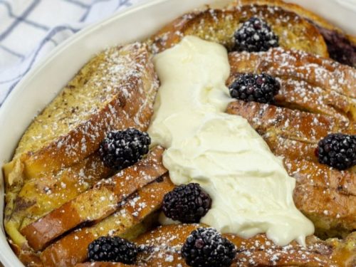 Blackberry Cream French Toast smothered with cream sauce and fresh balcberries