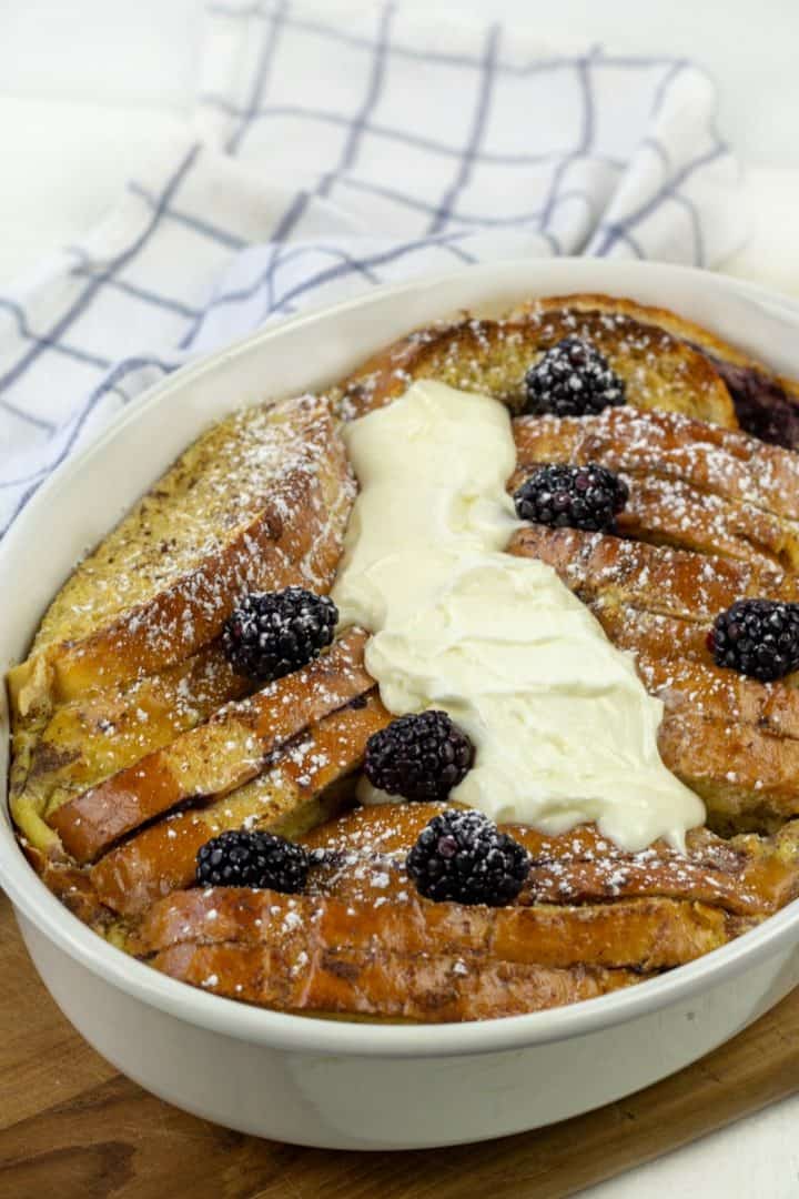 Blackberry Cream French Toast smothered with cream sauce and fresh balcberries