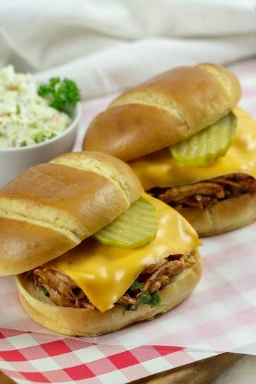 Super easy with shredded crock pot chicken, these tasty barbecue chicken sliders are ready in a jif! #mustlovehomecooking