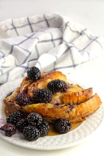 Blackberry covered oven french toast with maple syrup