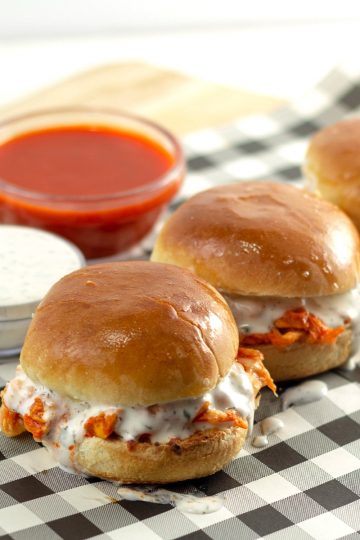 GET THE PARTY STARTED WITH THESE SPICY SLIDERS OOZING WITH MELTED CHEESE AND HOMEMADE BUTTERMILK RANCH DRESSING