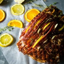 Citrus Stuffed Spiral Ham -Citrus slices, garlic and herbs steam in flavor as this holiday favorite bakes!