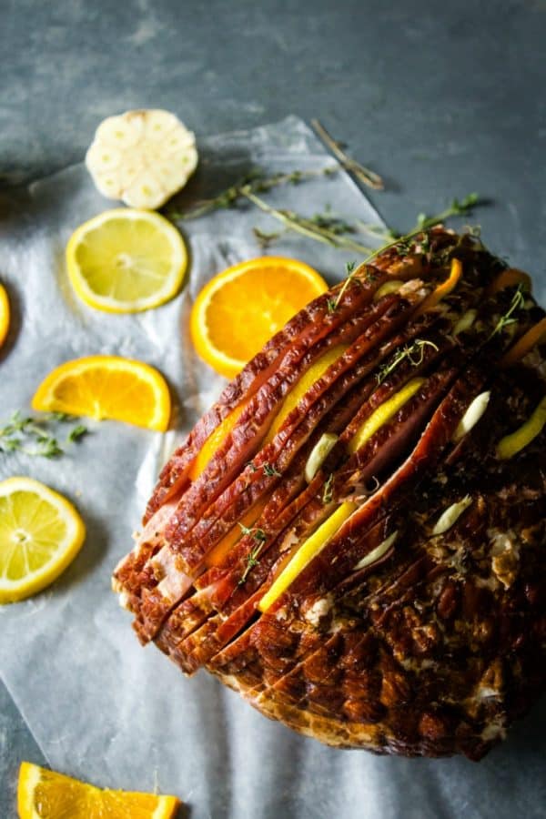 Citrus Stuffed Spiral Ham -Citrus slices, garlic and herbs steam in flavor as this holiday favorite bakes!