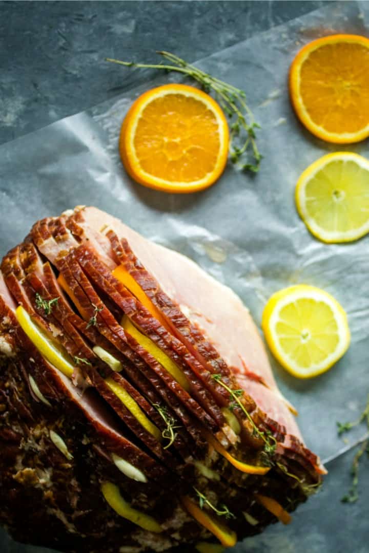 Citrus Stuffed Spiral Ham - Citrus slices, garlic and herbs steam in flavor as this holiday favorite bakes! 