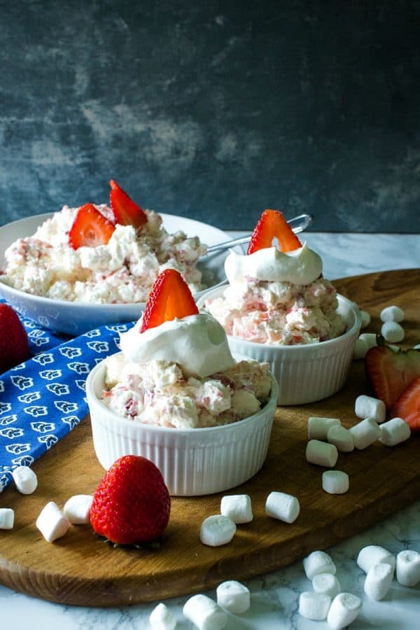 Strawberry Cheesecake Fluff Recipe -Fresh strawberries, Greek yogurt, cheesecake pudding mix, marshmallows and whipped topping come together in minutes for a quick and easy dessert or side dish!