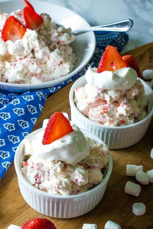 Strawberry Cheesecake Fluff Recipe -Fresh strawberries, Greek yogurt, cheesecake pudding mix, marshmallows and whipped topping come together in minutes for a quick and easy dessert or side dish!