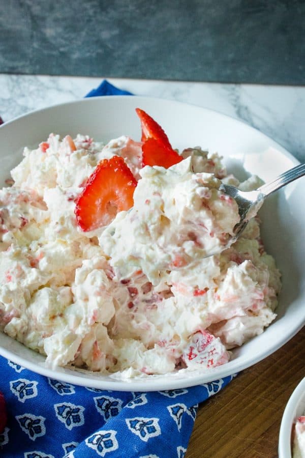 Strawberry Cheesecake Fluff Recipe -Fresh strawberries, Greek yogurt, cheesecake pudding mix, marshmallows and whipped topping come together in minutes for a quick and easy dessert or side dish!