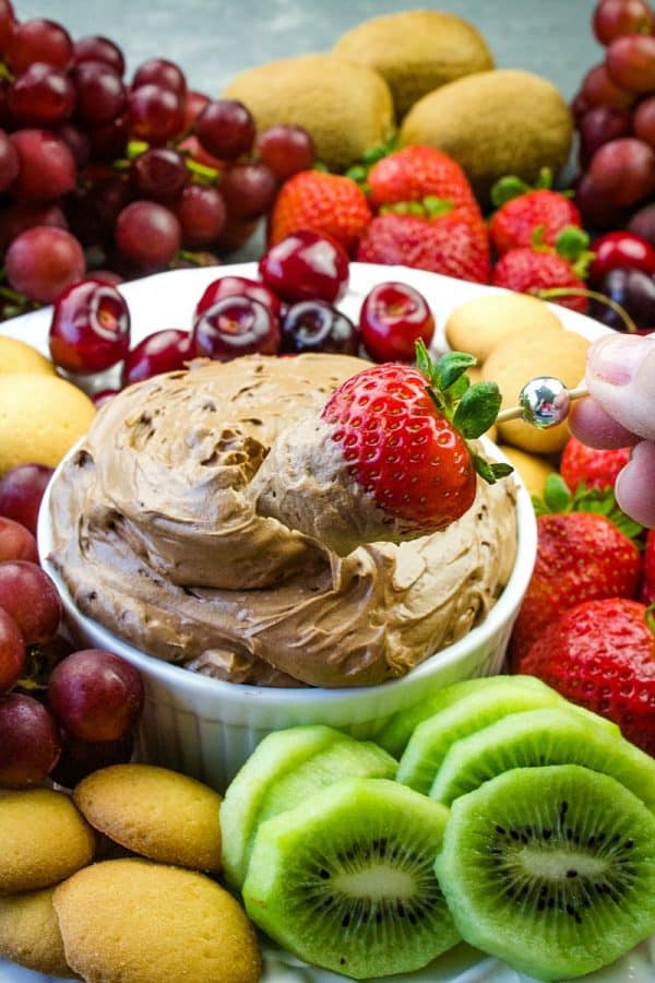 Chocolate Lovers  Fruit Dip is a cool and creamy treat made with melted chocolate, cocoa, cream cheese and luscious whipped cream. This delicious chocolate dip is great for parties, dessert or after school snacks!  #mustlovehomecooking