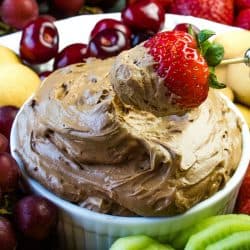 Chocolate Lovers Fruit Dip is a cool and creamy treat made with melted chocolate, cocoa, cream cheese and luscious whipped cream. This delicious chocolate dip is great for parties, dessert or after school snacks! #mustlovehomecooking