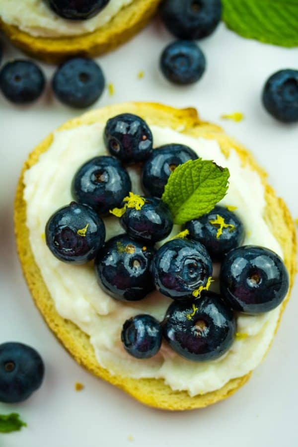 Blueberry Honey Whipped Ricotta Crostini -Blueberries, ricotta cheese and honey are paired to make this elegant perfect party appetizer!