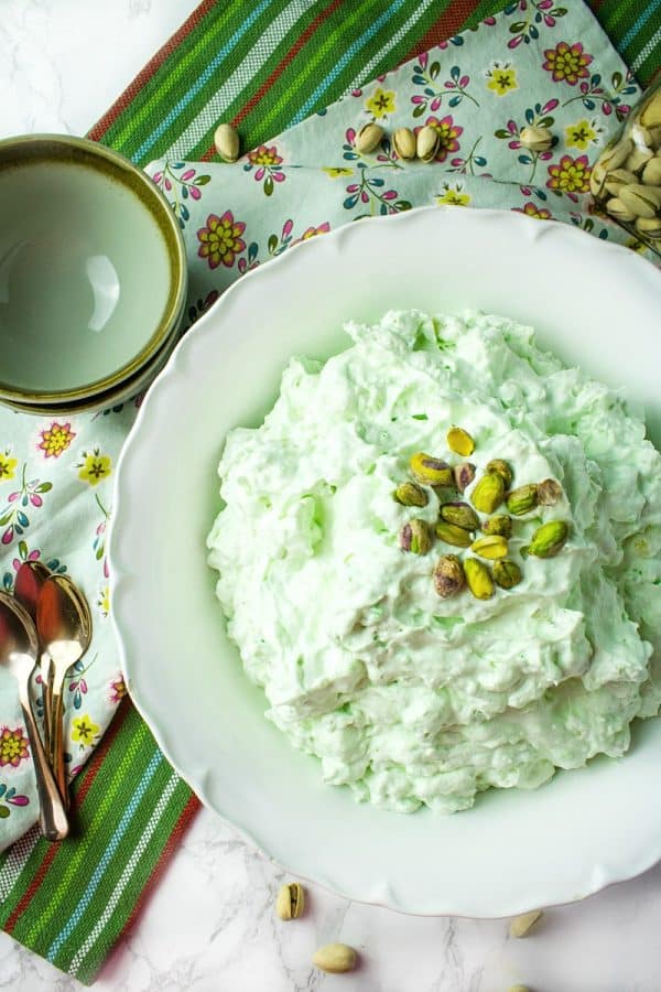 Pistachio Pineapple Fluff - aka Watergate Pudding, is a luscious holiday dessert of whipped topping, pudding mix, pineapple, marshmallow and pistachios.