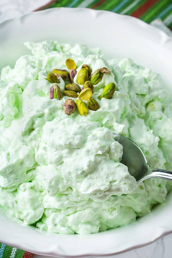 Pistachio Pineapple Fluff - aka Watergate Pudding, is a luscious holiday dessert of whipped topping, pudding mix, pineapple, marshmallow and pistachios.