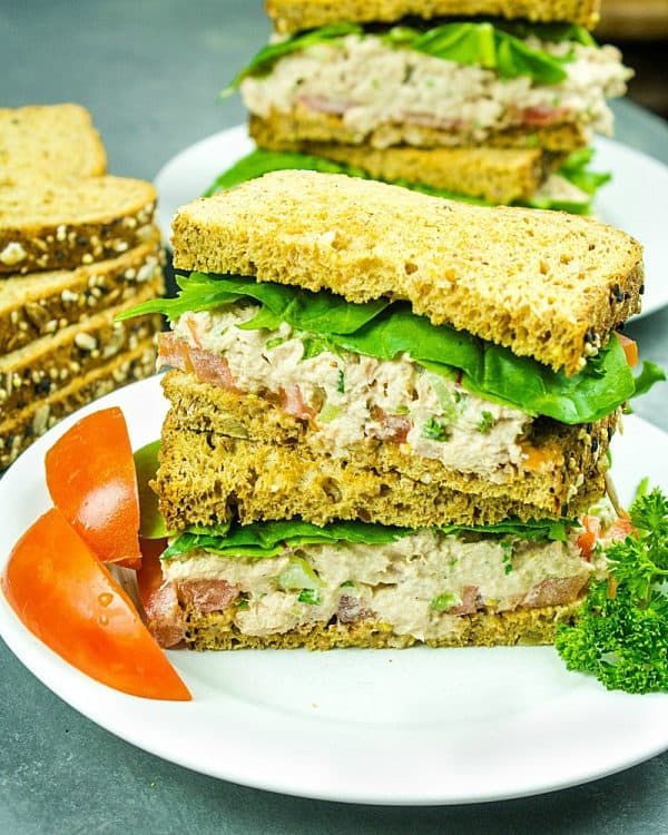Loaded with tuna, crunchy sweet red pepper, green onions, celery, relish and seasonings, this tasty Classic Tuna Salad Recipe is great for a light meal or anytime snack! #mustlovehomecooking