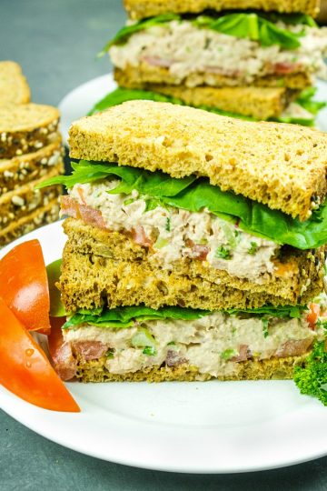 Loaded with tuna, crunchy sweet red pepper, green onions, celery, relish and seasonings, this tasty Classic Tuna Salad Recipe is great for a light meal or anytime snack! #mustlovehomecooking