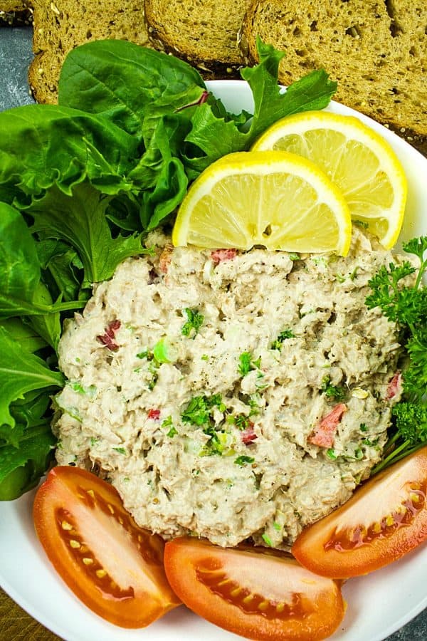 Loaded with tuna, crunchy sweet red pepper, green onions, celery, relish and seasonings, this tasty Classic Tuna Salad Recipe is great for a light meal or anytime snack! #mustlovehomecooking