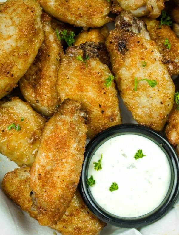 Make these EASY oven-baked chicken wings, coated in a brown sugar and Cajun spice rub.
