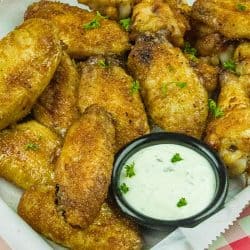 Make these EASY oven-baked chicken wings, coated in a brown sugar and Cajun spice rub.