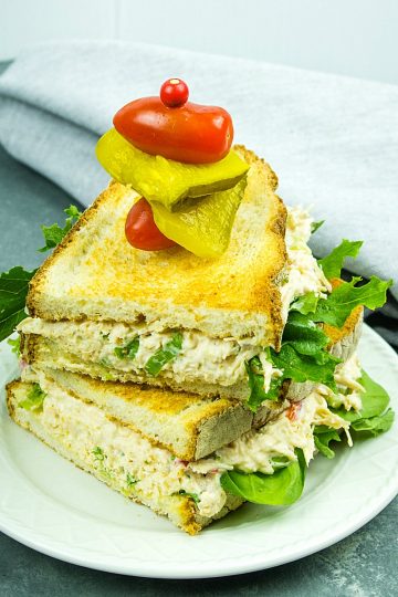 Best Ever Chicken Salad - Shredded chicken, red bell pepper, green onions, celery, nuts and seasonings make this classic salad a tasty anytime sandwich topping!