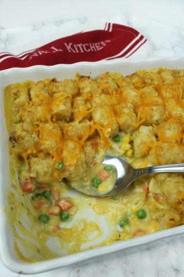 Full of chicken, vegetables and a creamy sauce that makes an irresistible family size Chicken Tater Tot Casserole freezer meal!