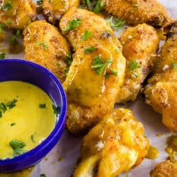 Tangy and sweet, these crispy honey mustard chicken wings coated with a zesty mustard sauce are always a hit for parties, gamedays or an easy meal!
