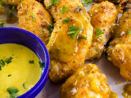 Tangy and sweet, these crispy honey mustard chicken wings coated with a zesty mustard sauce are always a hit for parties, gamedays or an easy meal!