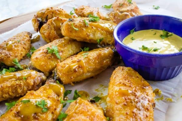 Tangy and sweet, these crispy honey mustard chicken wings coated with a zesty mustard sauce are always a hit for parties, gamedays or an easy meal!