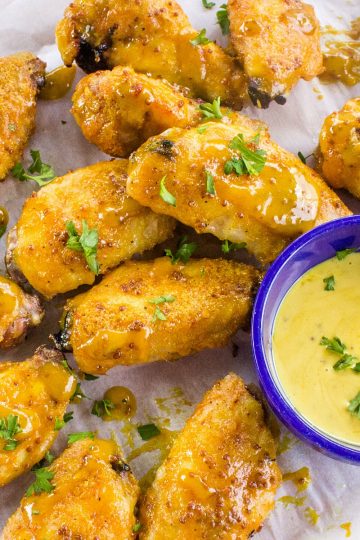 Tangy and sweet, these crispy honey mustard chicken wings coated with a zesty mustard sauce are always a hit for parties, gamedays or an easy meal!