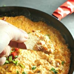 Creamy and cheesy, this Buffalo Chicken Dip is a favorite spicy party appetizer. Simple to make with ingredients like shredded chicken, wing sauce, ranch dressing and mozzarella cheese.