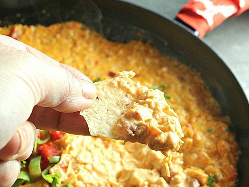 Creamy and cheesy, this Buffalo Chicken Dip is a favorite spicy party appetizer. Simple to make with ingredients like shredded chicken, wing sauce, ranch dressing and mozzarella cheese.