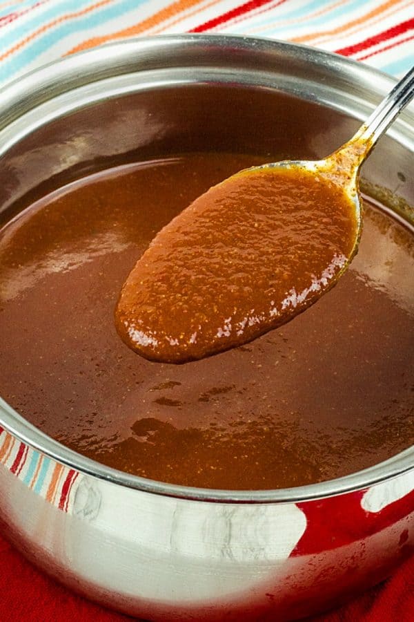 Easy Red Enchilada Sauce, a mixture of tomato sauce, vegetable broth plus Mexican spices creates a thick Red Enchilada Sauce for enchiladas, tamales, Mexican lasagna and more!