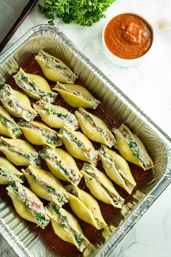Healthy cheese and veggie stuffed pasta shells made ahead for an easy freezer family meal. 