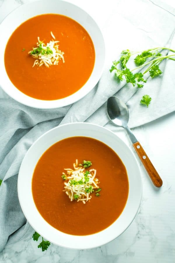 Onion, tomatoes, garlic and butter are all you need to make homemade tomato soup. It's a thick and delicious soup that comes together in under an hour.