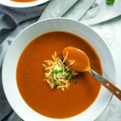 Onion, tomatoes, garlic and butter are all you need to make homemade tomato soup. It's a thick and delicious soup that comes together in under an hour.