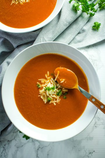 Onion, tomatoes, garlic and butter are all you need to make homemade tomato soup. It's a thick and delicious soup that comes together in under an hour.