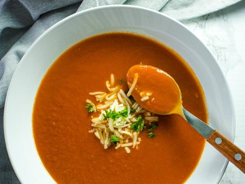 Onion, tomatoes, garlic and butter are all you need to make homemade tomato soup. It's a thick and delicious soup that comes together in under an hour.