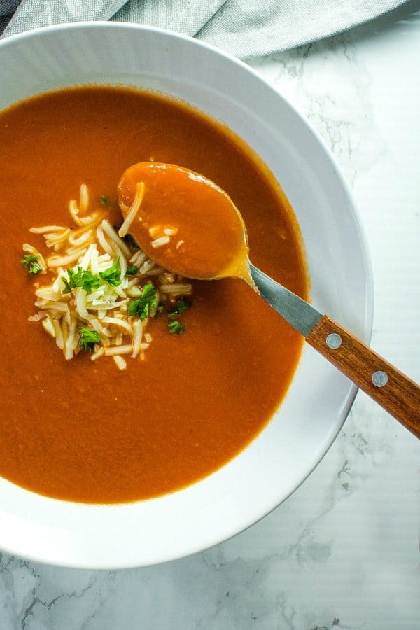 Onion, tomatoes, garlic and butter are all you need to make homemade tomato soup. It's a thick and delicious soup that comes together in under an hour.