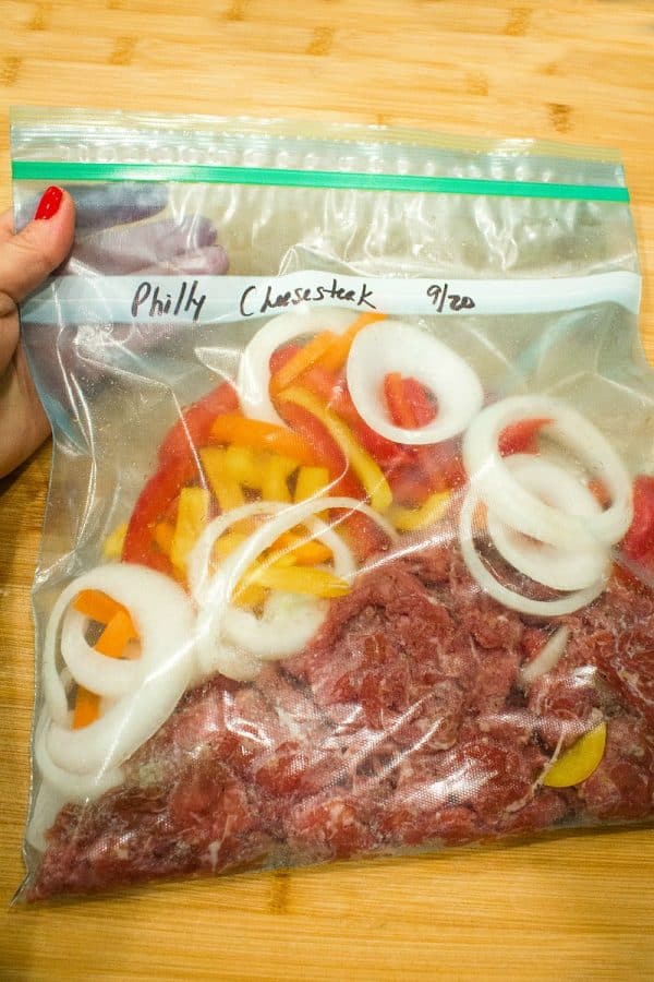 This easy freezer meal Philly cheese steak is the BEST! With tender shaved steak, peppers, onions and spices it's everything you could want in a freezer meal -  delicious, pan ready and served in minutes.