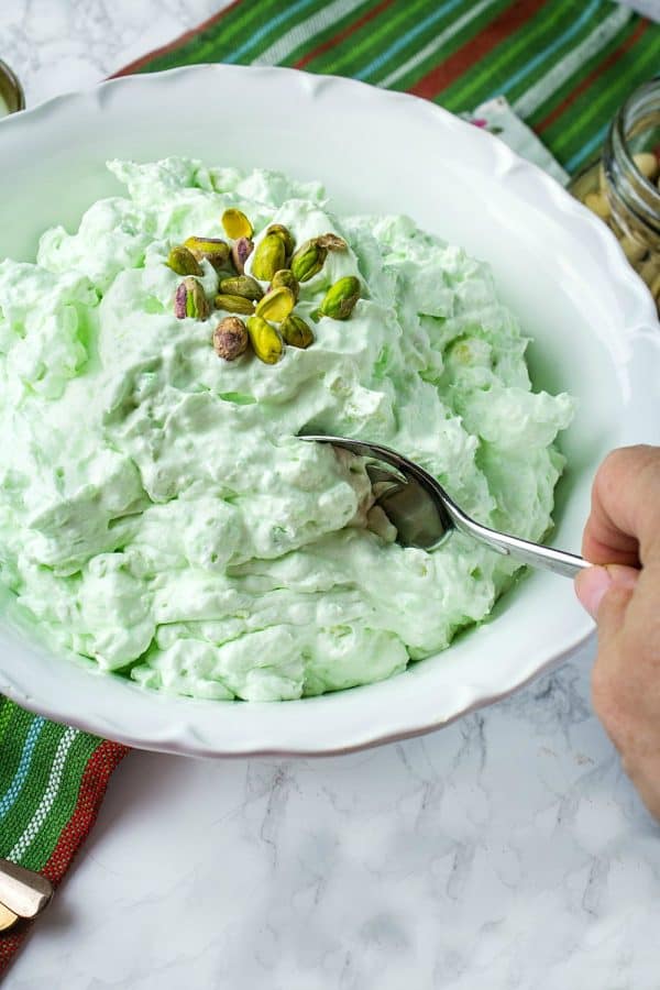 Pistachio Pineapple Fluff - aka Watergate Pudding, is a luscious holiday dessert of whipped topping, pudding mix, pineapple, marshmallow and pistachios.