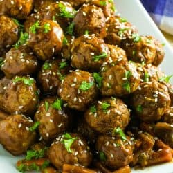 Slow Cooker Asian Barbecue Meatballs with frozen meatballs, vegetables, teriyaki sauce, barbecue sauce and srirachi are just what you need to make these sweet and spicy meatballs.